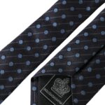 Black and blue polka dot silk men's tie with adjustable length from Dolce & Gabbana, featuring a classic pattern and smooth texture.