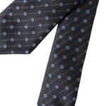 Black and blue polka dot silk men's tie by Dolce & Gabbana, adjustable with a classic polka dot pattern and silk fabric.