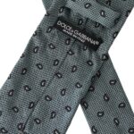 Green patterned silk men's tie by Dolce & Gabbana featuring an adjustable design and intricate pattern.