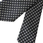 Black 100% silk patterned adjustable men's tie by Dolce & Gabbana, featuring elegant design and classic knot style.