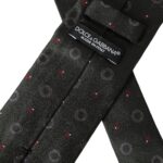 Dark gray silk men's tie by Dolce & Gabbana with a fantasy pattern, featuring an adjustable design and elegant texture.