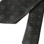 Dark gray 100% silk fantasy men's tie by Dolce & Gabbana, featuring an adjustable strap and elegant design.