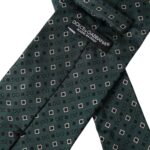 Green silk men's tie with Dolce & Gabbana branded logo, adjustable length and classic design.