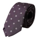 Purple silk polka dot men's tie by Dolce & Gabbana, adjustable with classic pattern, shown flat on a neutral background.