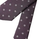 Purple silk polka dot men's tie by Dolce & Gabbana, adjustable with a classic design, shown laid flat.