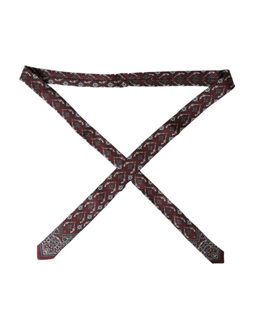 Dolce & Gabbana Bordeaux printed 100% silk adjustable men's tie showing intricate silk fabric and stylish design.