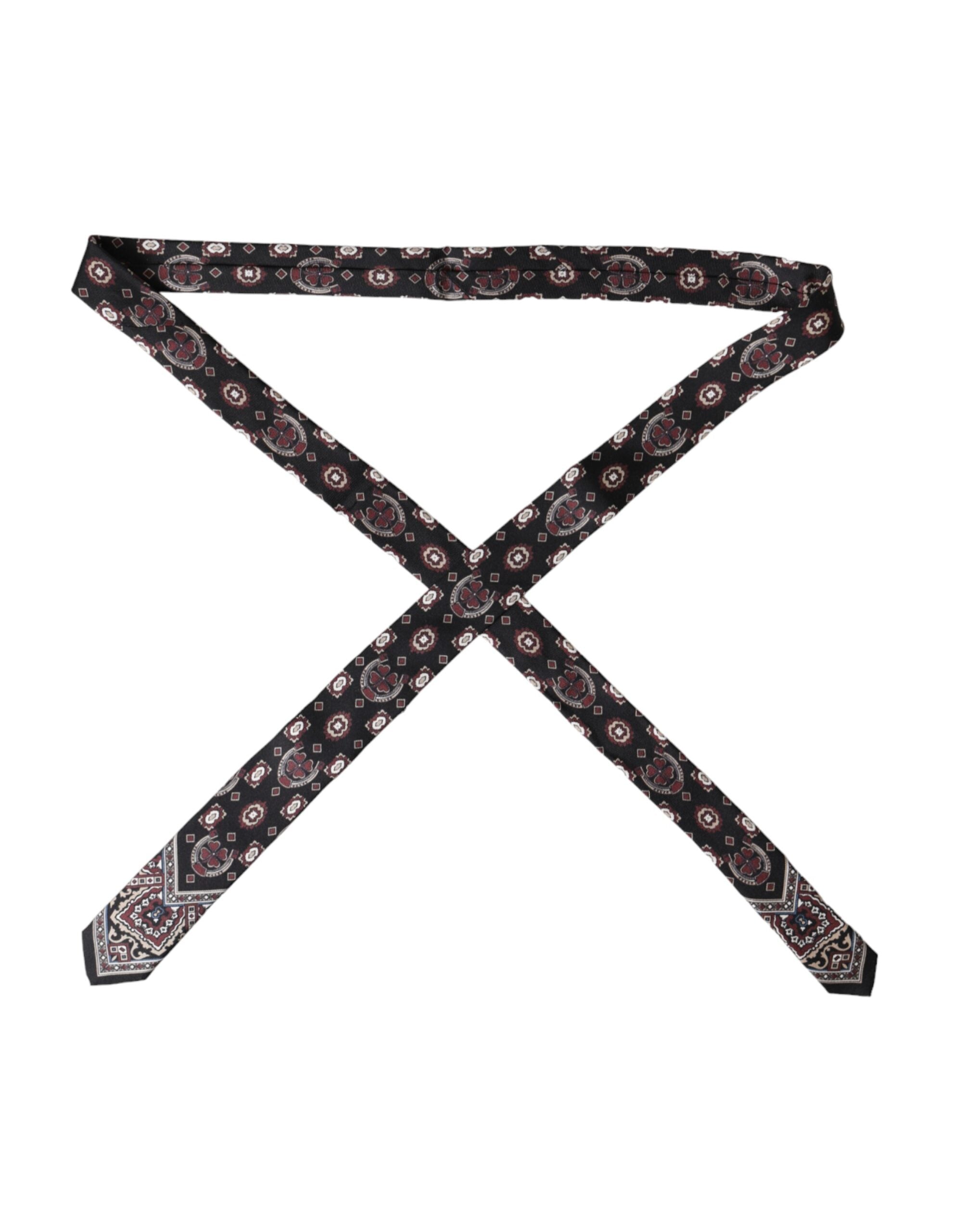 Black printed 100% silk men's adjustable tie by Dolce & Gabbana with intricate pattern and sleek design.