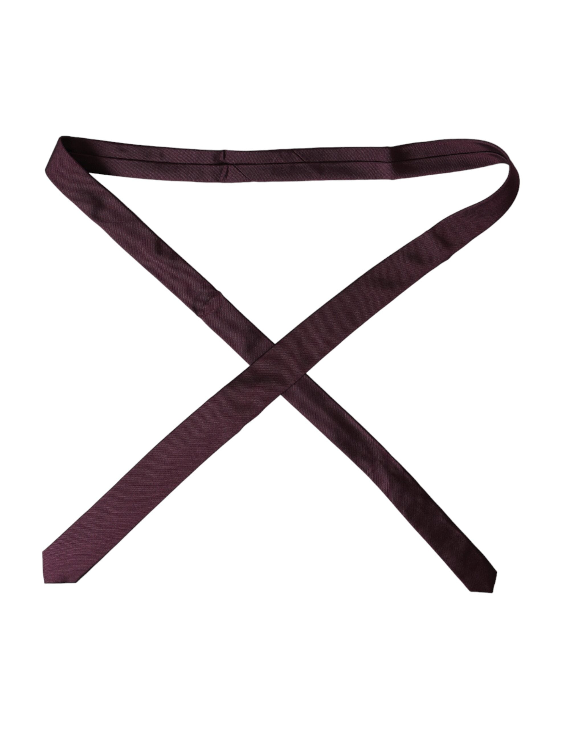 Dolce & Gabbana Bordeaux solid 100% silk men's adjustable tie displayed on a neutral background.