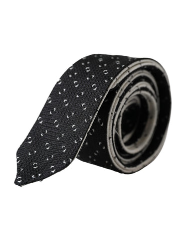 Black and white patterned adjustable tie by Dolce & Gabbana with intricate geometric design on smooth fabric.