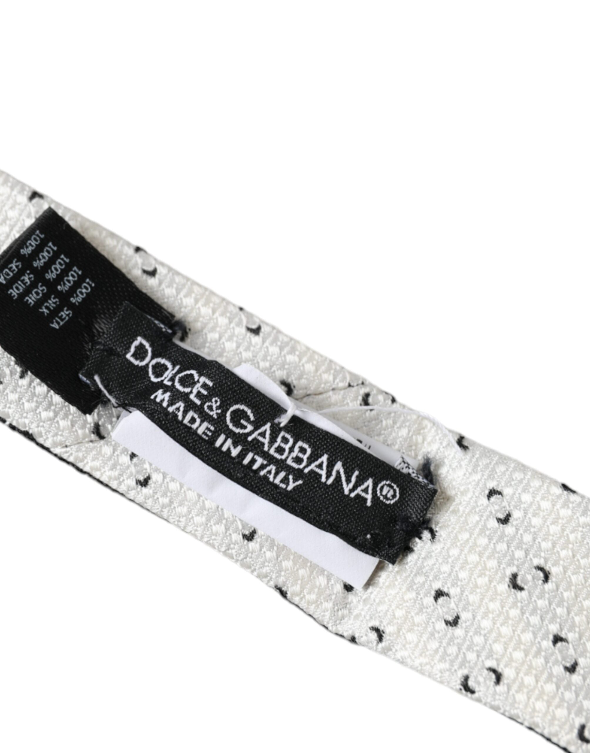 Black and white patterned adjustable tie by Dolce & Gabbana, featuring intricate design and classic style.
