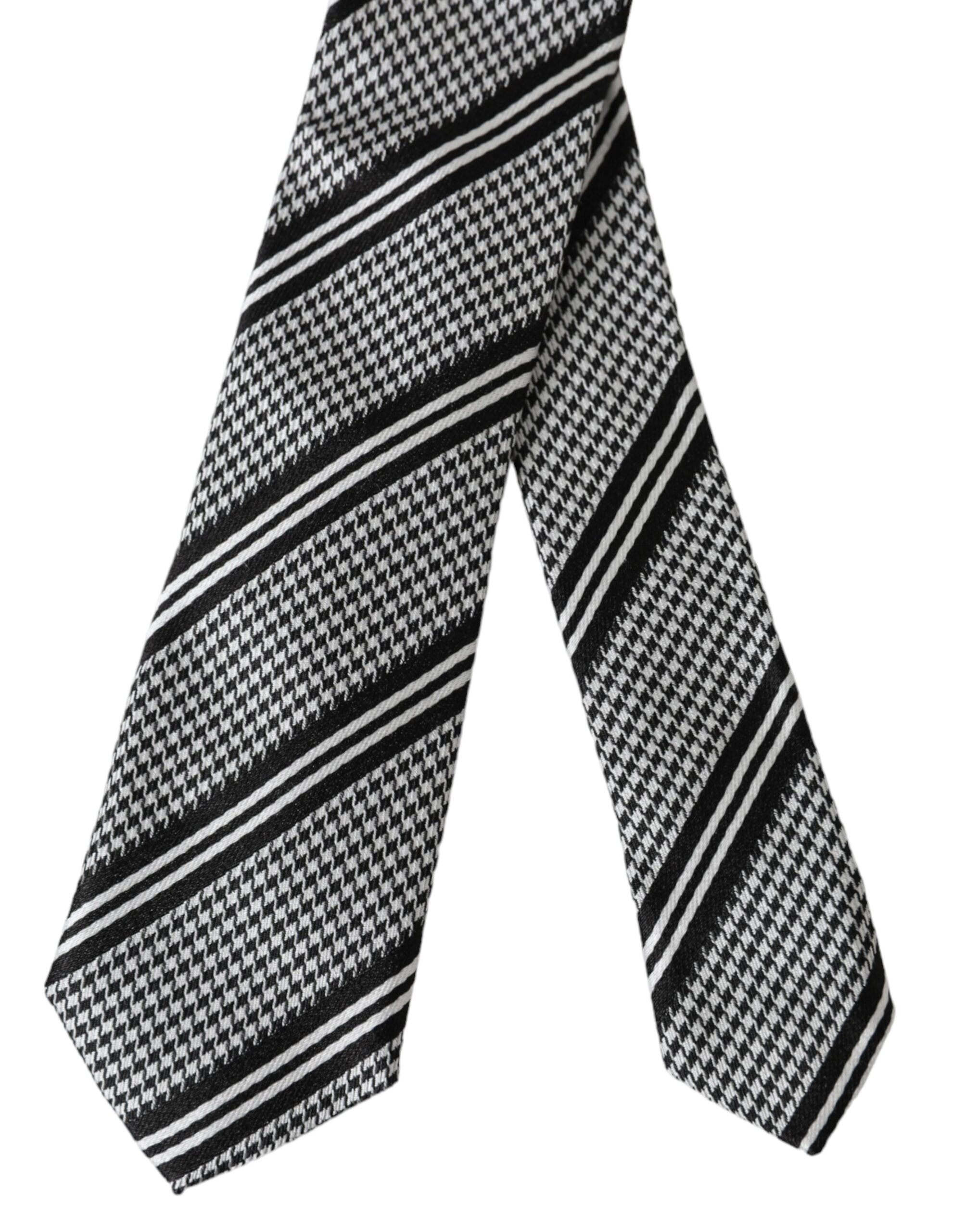 Black and white striped silk adjustable tie by Dolce & Gabbana displayed on a plain background.