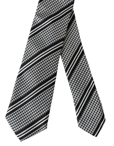 Black and white striped silk adjustable tie by Dolce & Gabbana displayed on a plain background.