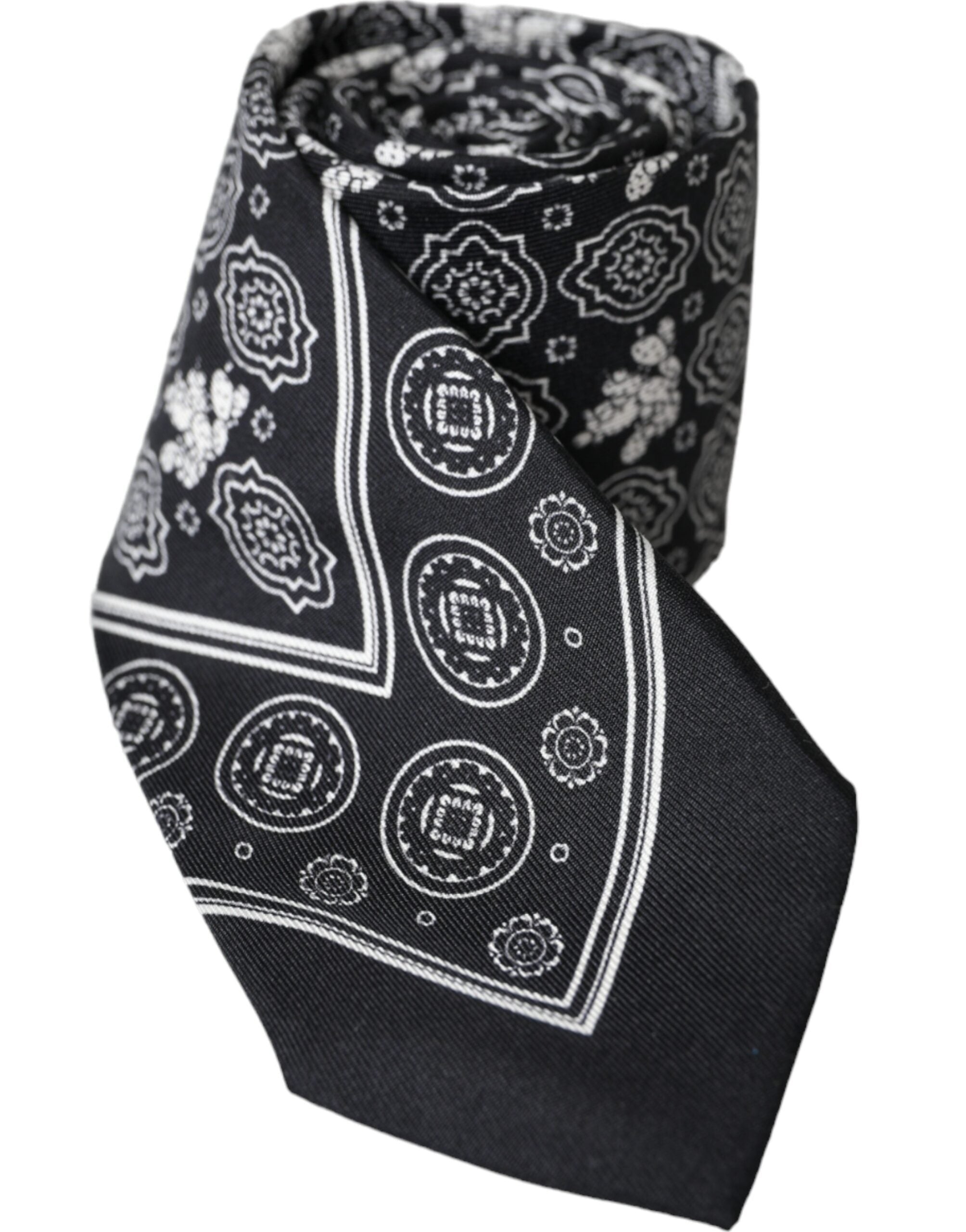 Black patterned 100% silk adjustable tie by Dolce & Gabbana, featuring a stylish design and classic knot on a neutral background.