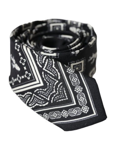 Black patterned 100% silk adjustable tie by Dolce & Gabbana, featuring a sleek design and elegant texture.