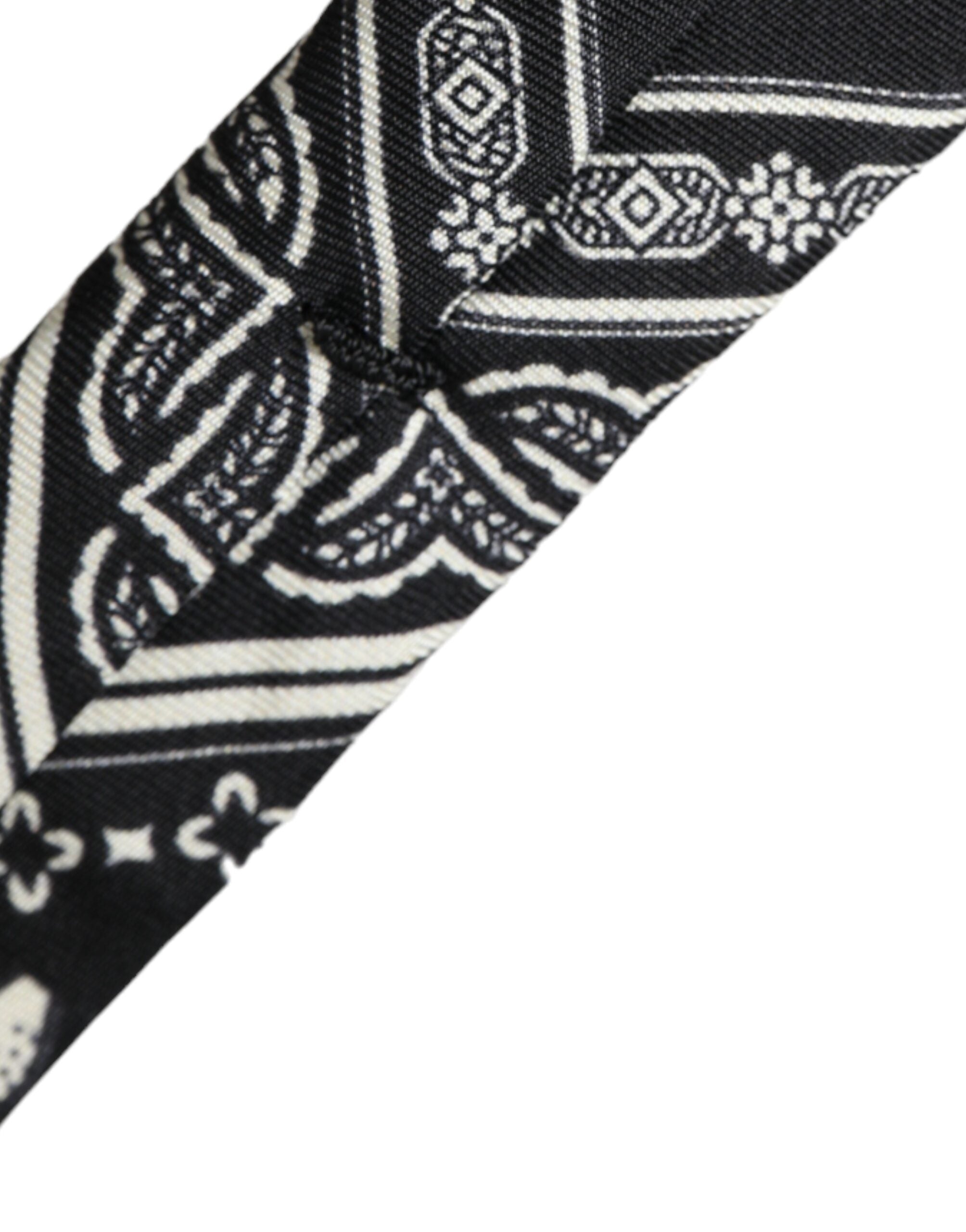 Black patterned 100% silk adjustable tie by Dolce & Gabbana, featuring elegant design and classic knot style.