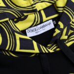 Black Dolce & Gabbana logo cotton hooded sweatshirt with front pocket and drawstring hood on a plain background.