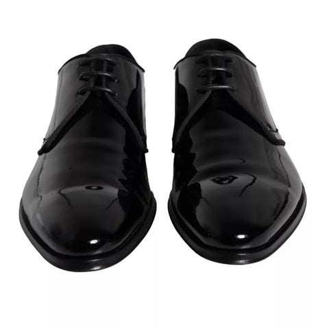 Black calfskin leather Derby men's dress shoes by Dolce & Gabbana, showing polished finish and classic design.