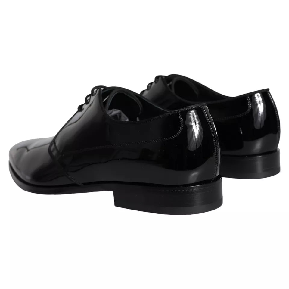 Black calfskin leather Derby men's dress shoes by Dolce & Gabbana, featuring sleek design and polished finish.