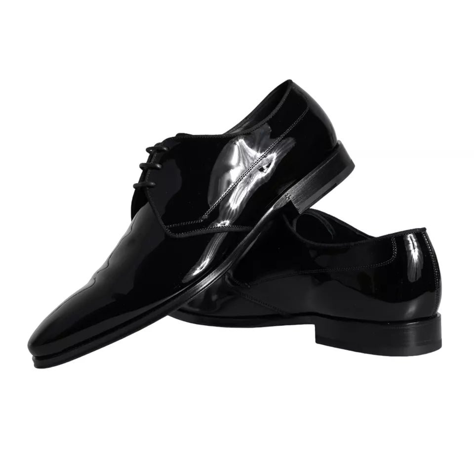 Black calfskin leather men's Derby dress shoes by Dolce & Gabbana, featuring sleek design and polished finish.