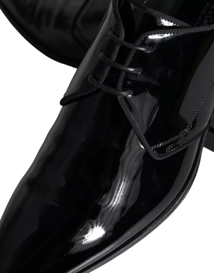 Black calfskin leather derby men's dress shoes by Dolce & Gabbana, featuring sleek design and polished finish.