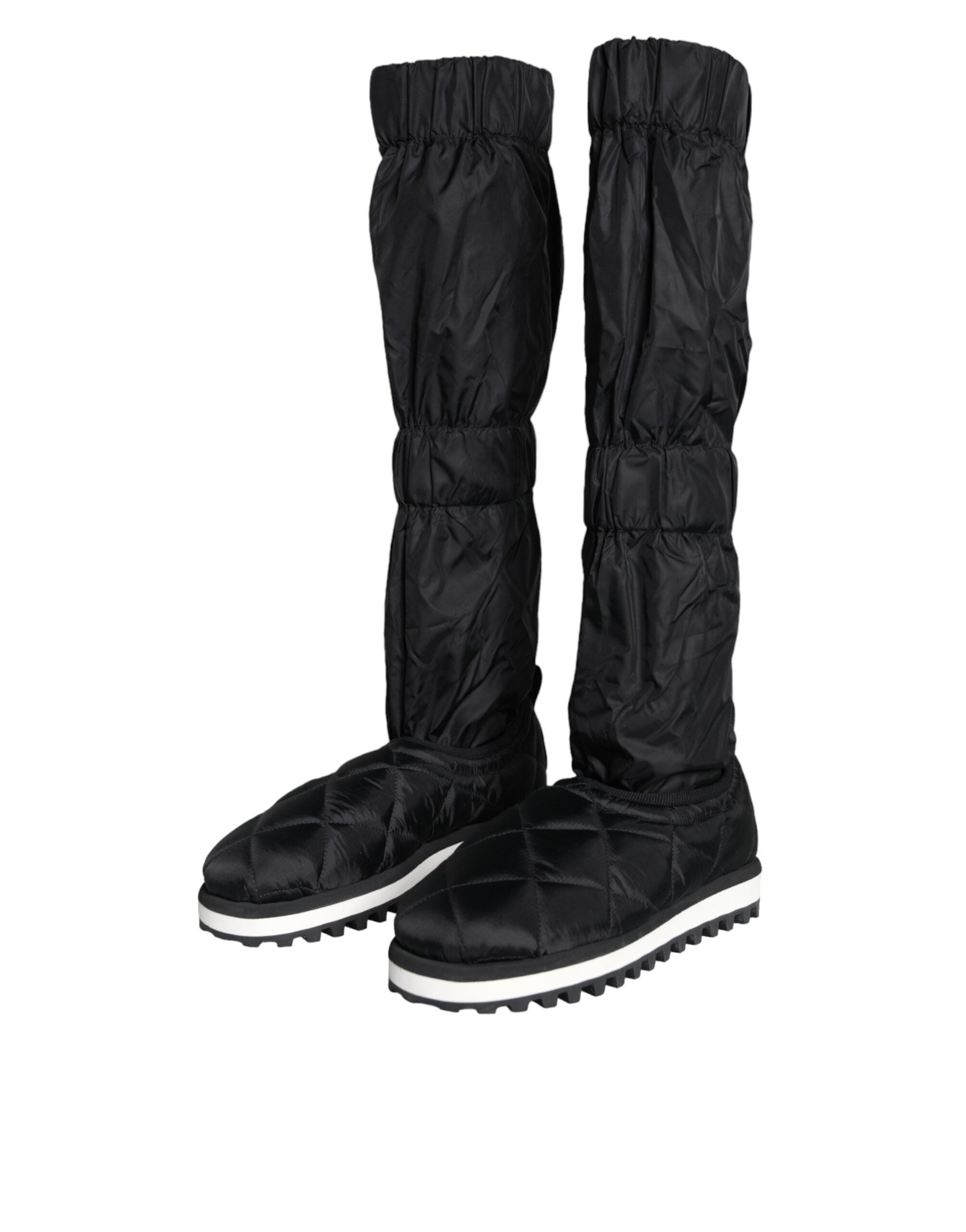 Black quilted high top sneakers by Dolce & Gabbana featuring a sleek design and textured quilting on the upper.