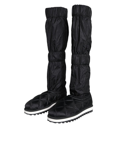 Black quilted high top sneakers by Dolce & Gabbana featuring a sleek design and textured quilting on the upper.