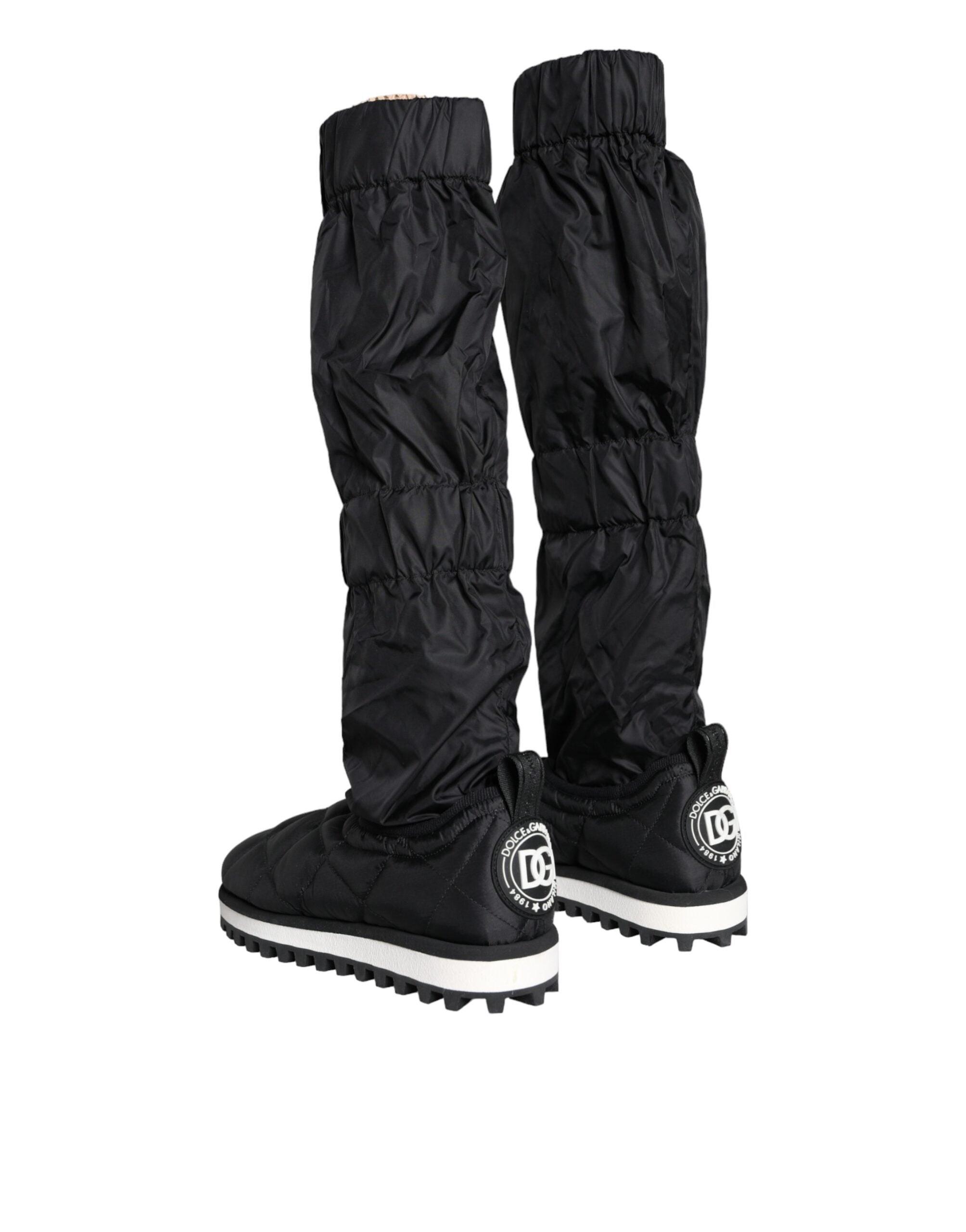 Black quilted high top sneakers from Dolce & Gabbana with laces and a stylish textured design.