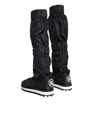 Black quilted high top sneakers from Dolce & Gabbana with laces and a stylish textured design.