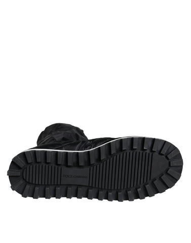 Black quilted high top sneakers by Dolce & Gabbana, stylish shoes with a quilted design and high ankle support.