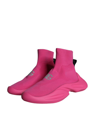 Pink slip-on sneakers with Dolce & Gabbana logo print, featuring a casual sneaker design and comfortable sole.