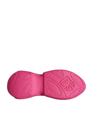 Pink slip-on sneakers with logo print from Dolce & Gabbana featuring a casual, stylish design and comfortable fit.