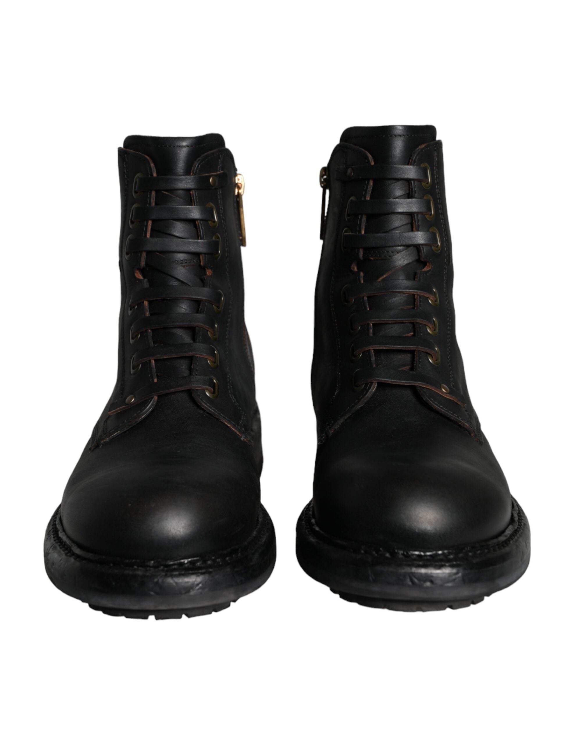 Black lace-up mid-calf men's boots by Dolce & Gabbana, featuring stylish leather design and sturdy sole.