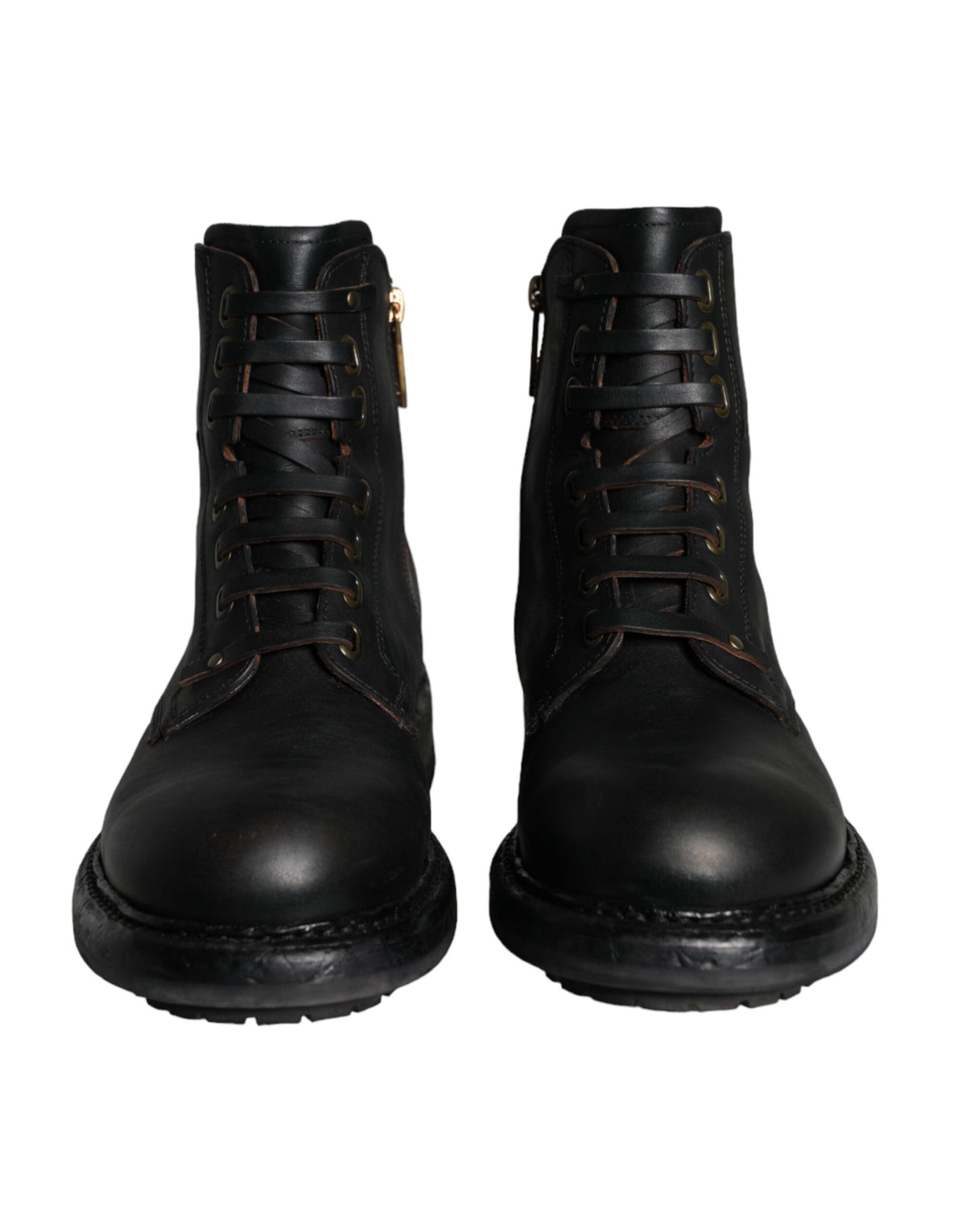 Black lace-up mid-calf men's boots by Dolce & Gabbana, featuring stylish leather design and sturdy sole.