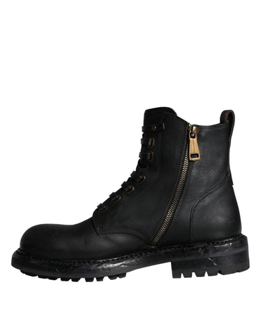 Black lace-up mid-calf men's boots by Dolce & Gabbana, featuring leather construction and stylish design.