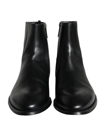 Black calf leather men's ankle boots by Dolce & Gabbana, featuring sleek design and sturdy sole.