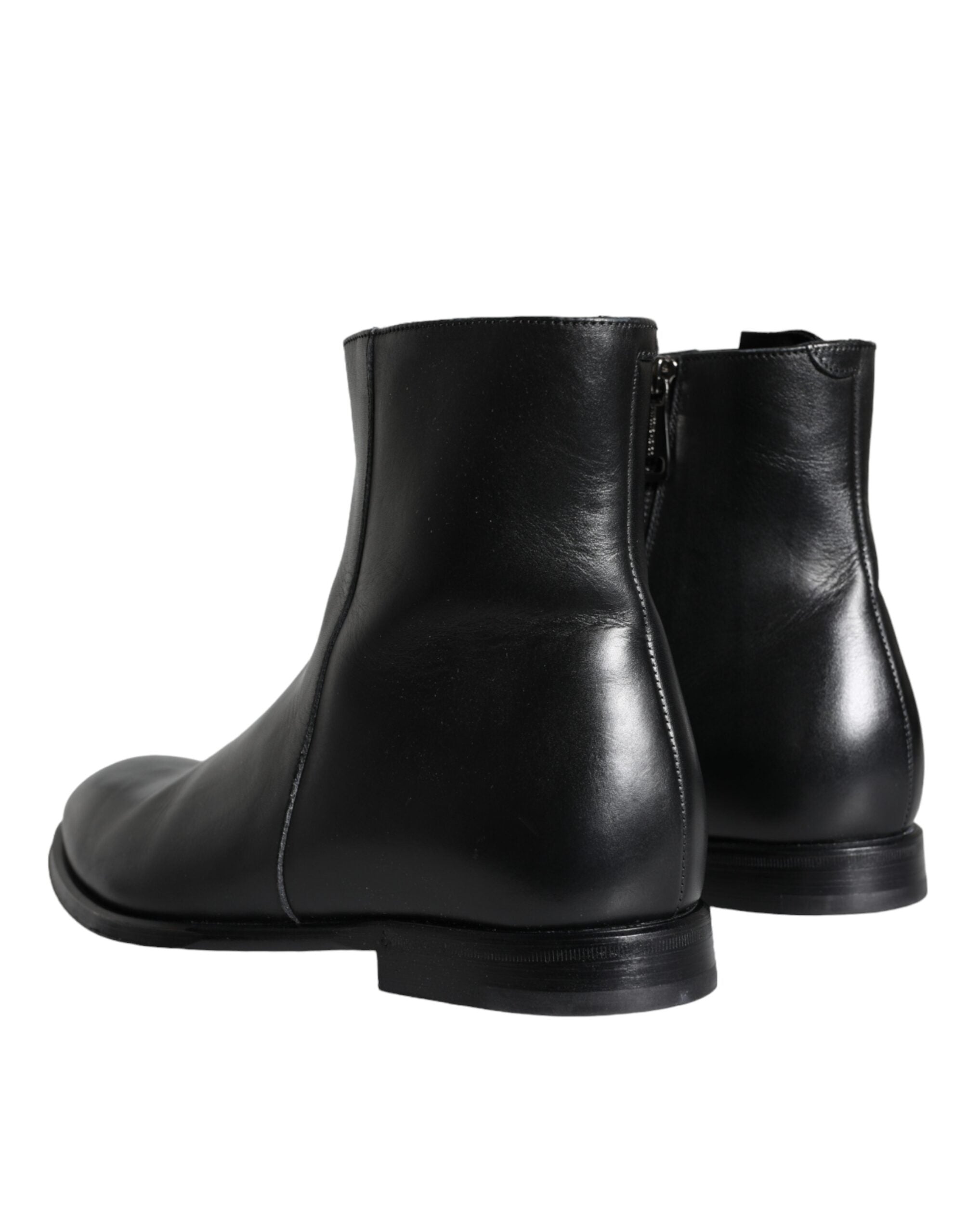Black calf leather men's ankle boots by Dolce & Gabbana, featuring sleek design and sturdy soles, suitable for stylish casual wear.