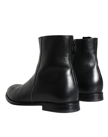 Black calf leather men's ankle boots by Dolce & Gabbana, featuring sleek design and sturdy soles, suitable for stylish casual wear.