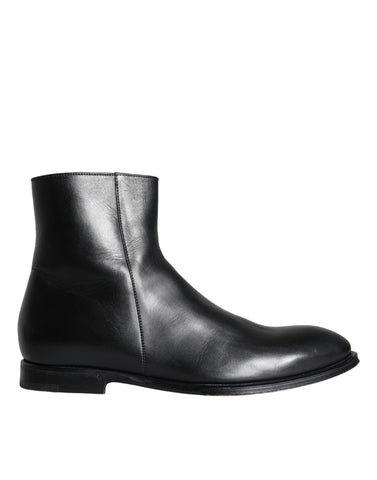 Black calf leather men's ankle boots by Dolce & Gabbana, featuring sleek design and stylish ankle-high silhouette.
