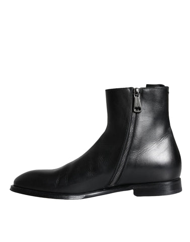 Black calf leather men's ankle boots by Dolce & Gabbana, featuring sleek design and stylish ankle-height silhouette.