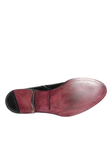 Black calf leather ankle boots for men by Dolce & Gabbana, featuring sleek design and polished finish.