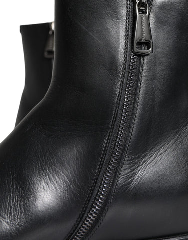 Black calf leather men's ankle boots by Dolce & Gabbana, featuring sleek design and durable leather construction.