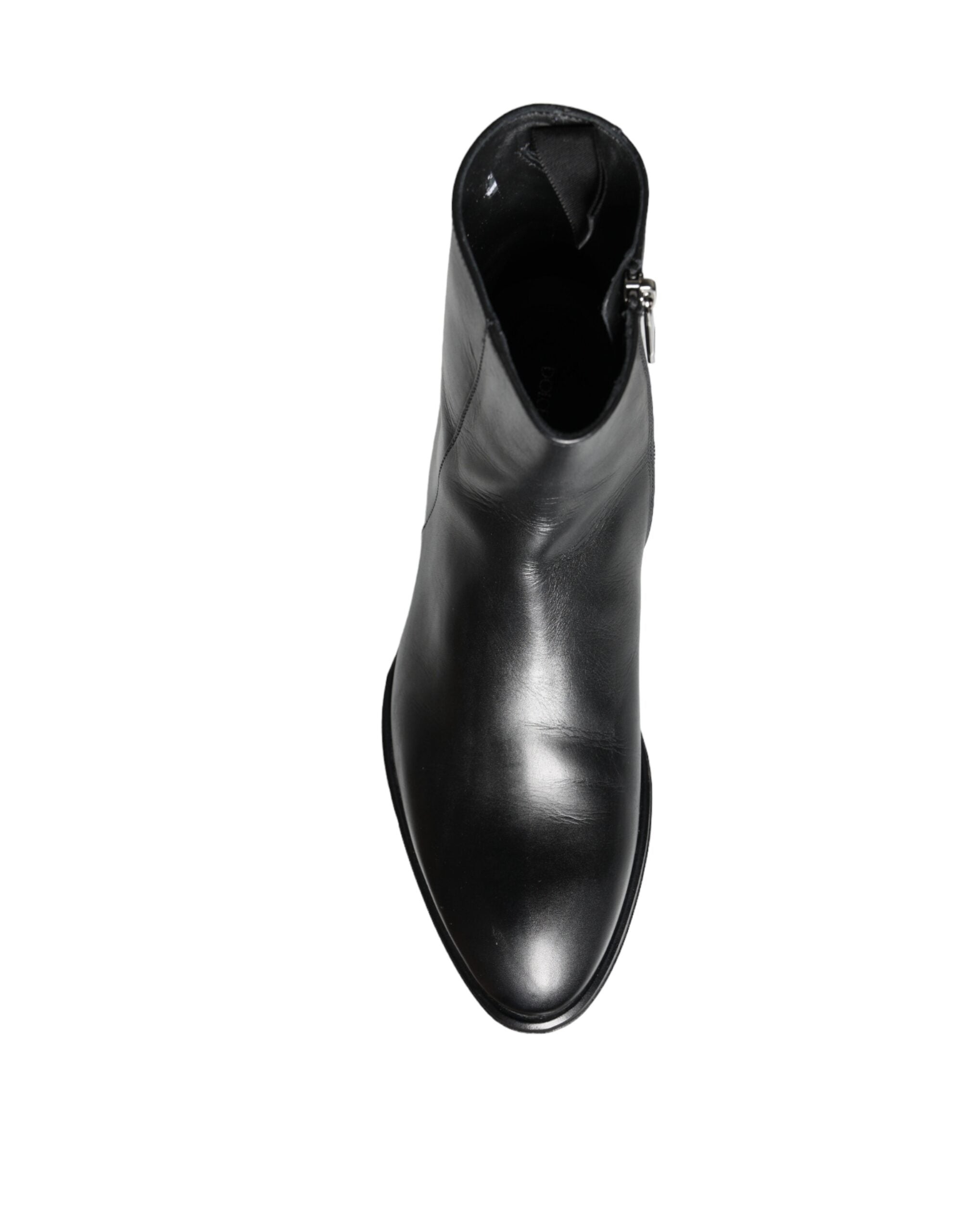 Black calf leather men's ankle boots by Dolce & Gabbana, featuring sleek design and lace-up closure.