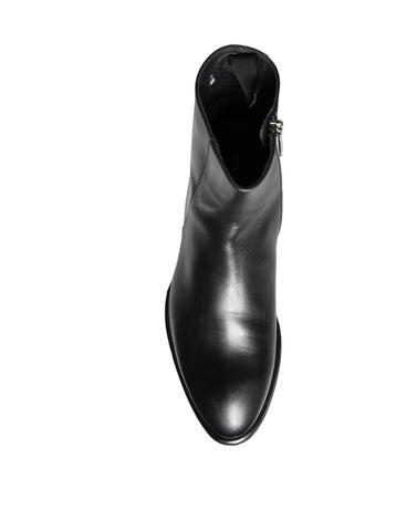 Black calf leather men's ankle boots by Dolce & Gabbana, featuring sleek design and lace-up closure.