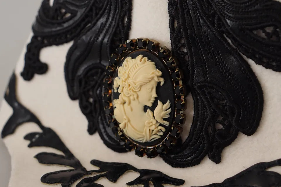 White and black wool embroidered cameo brooch on a hat, featuring intricate D&G Dolce & Gabbana craftsmanship.