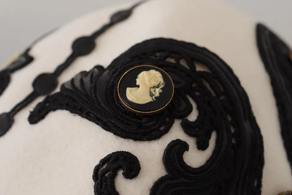 White and black wool embroidered cameo brooch on a stylish hat, featuring intricate detailing by Dolce & Gabbana.