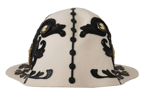 White and black wool embroidered cameo brooch attached to a hat, designed by Dolce & Gabbana.