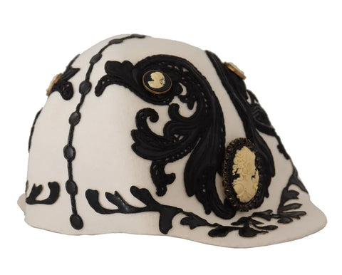 White and black wool embroidered cameo brooch on a hat, featuring intricate Dolce & Gabbana design and embellishments.