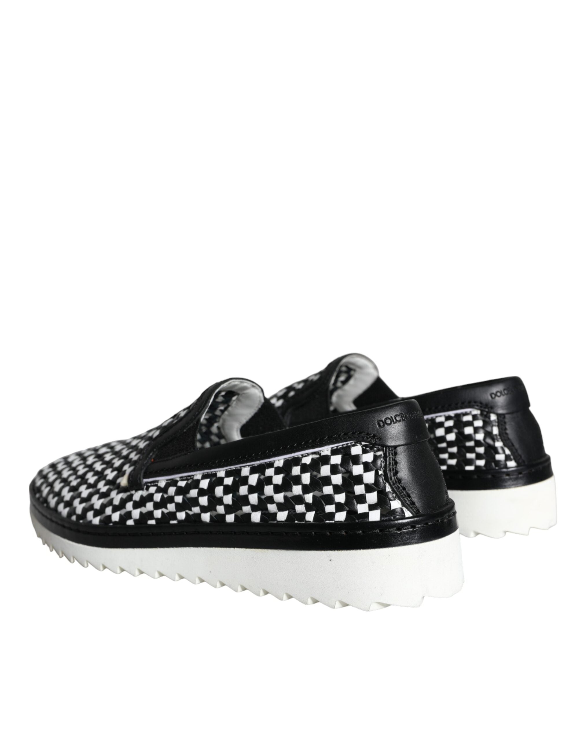 Black and white woven slip-on men's loafers by Dolce & Gabbana, featuring a stylish and comfortable design.