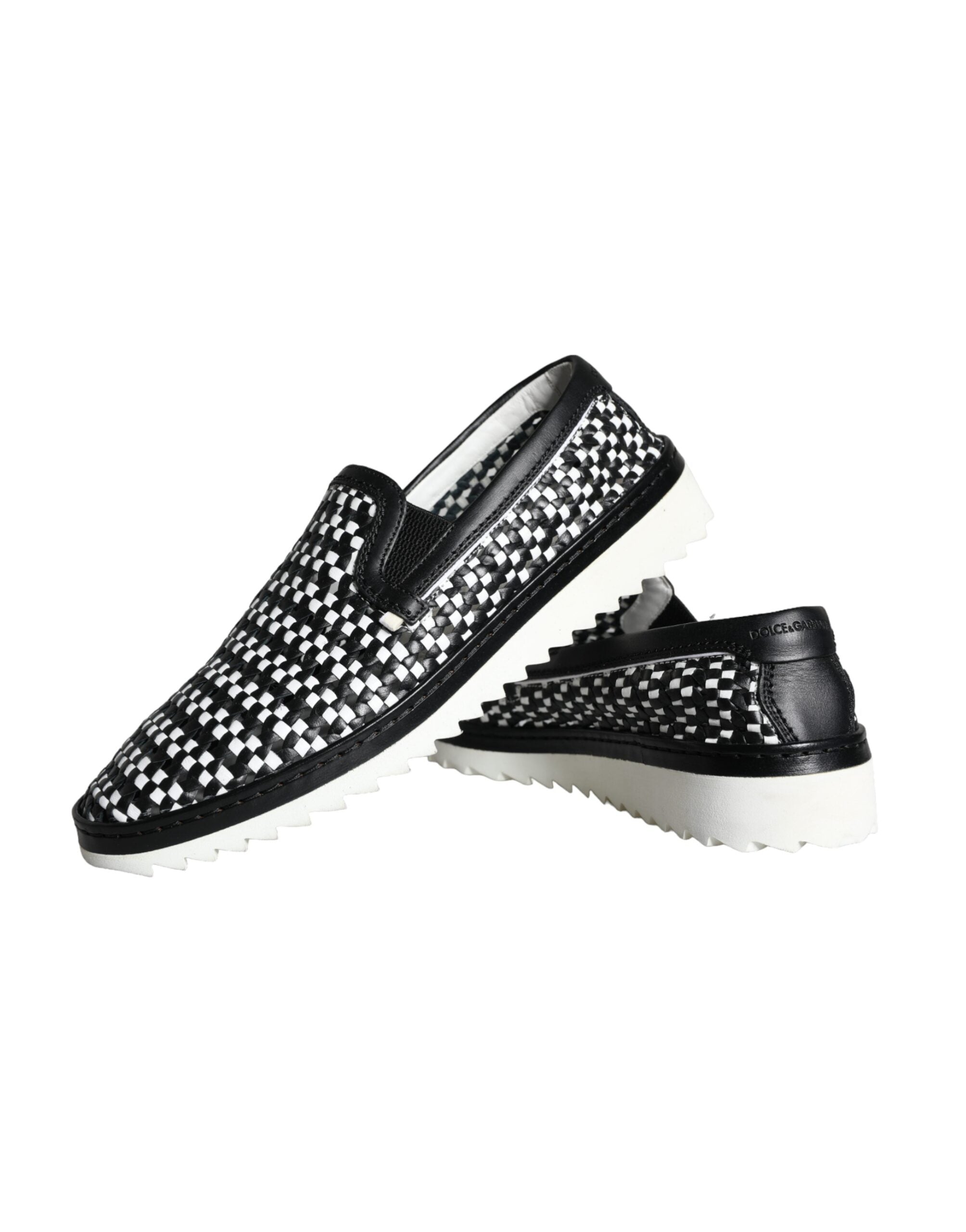 Black and white woven slip-on men’s loafers by Dolce & Gabbana, featuring a stylish, textured design and comfortable fit.