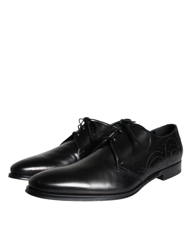 Black calfskin leather Derby men's dress shoes by Dolce & Gabbana, featuring sleek design and polished finish.